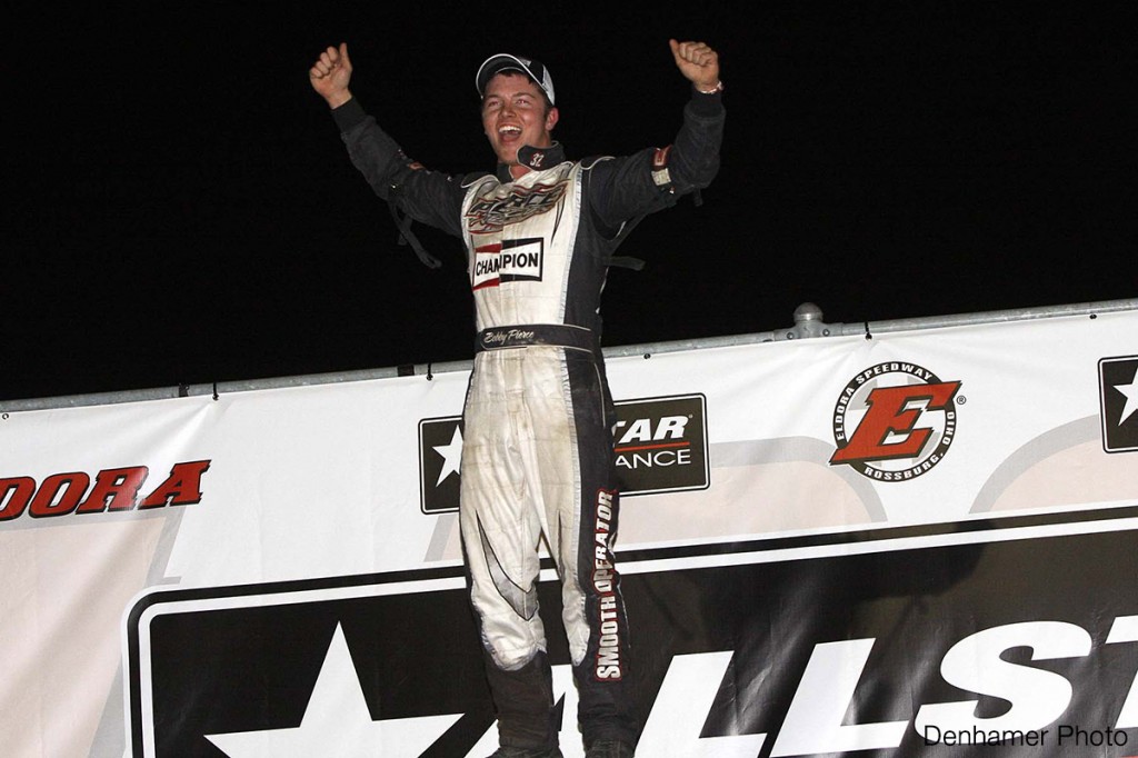 Bobby Pierce celebrates as he exits his winning race car.