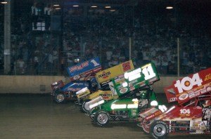 Sammy Swindell (1), Jac Haudenschild (22) and Steve Kinser (11) help pace the 4-wide parade lap in the 1998 Kings Royal