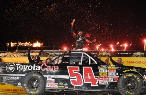 Darrell Wallace Jr exits his winning truck at the conclusion of the 2014 NCWTS event.