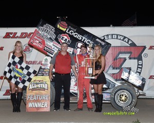 Greg Wilson is joined in victory lane by Ms Eldora and NKTelco GM Preston Meyer.