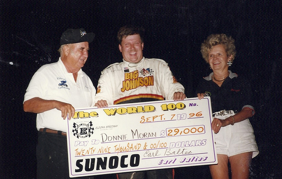 900px-BB_0016_9-7-1996 Earl and Bernice Baltes share the victory podium with World 100 winner Donnie Moran by Jeremey’s
